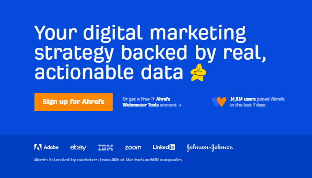 Ahrefs promotional image showcasing its benefits with the text 'Your digital marketing strategy backed by real, actionable data' accompanied by a thumbs-up emoji. Includes a bright orange 'Sign up for Ahrefs' button and highlights 14,814 new users in the last 7 days. Logos of major companies like Adobe, eBay, IBM, Zoom, LinkedIn, and Johnson & Johnson appear below, emphasizing its trust by marketers from 44% of Fortune 500 companies.